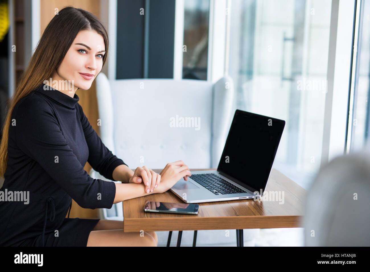 Young beauty businesswoman using laptop in cafe Stock Photo