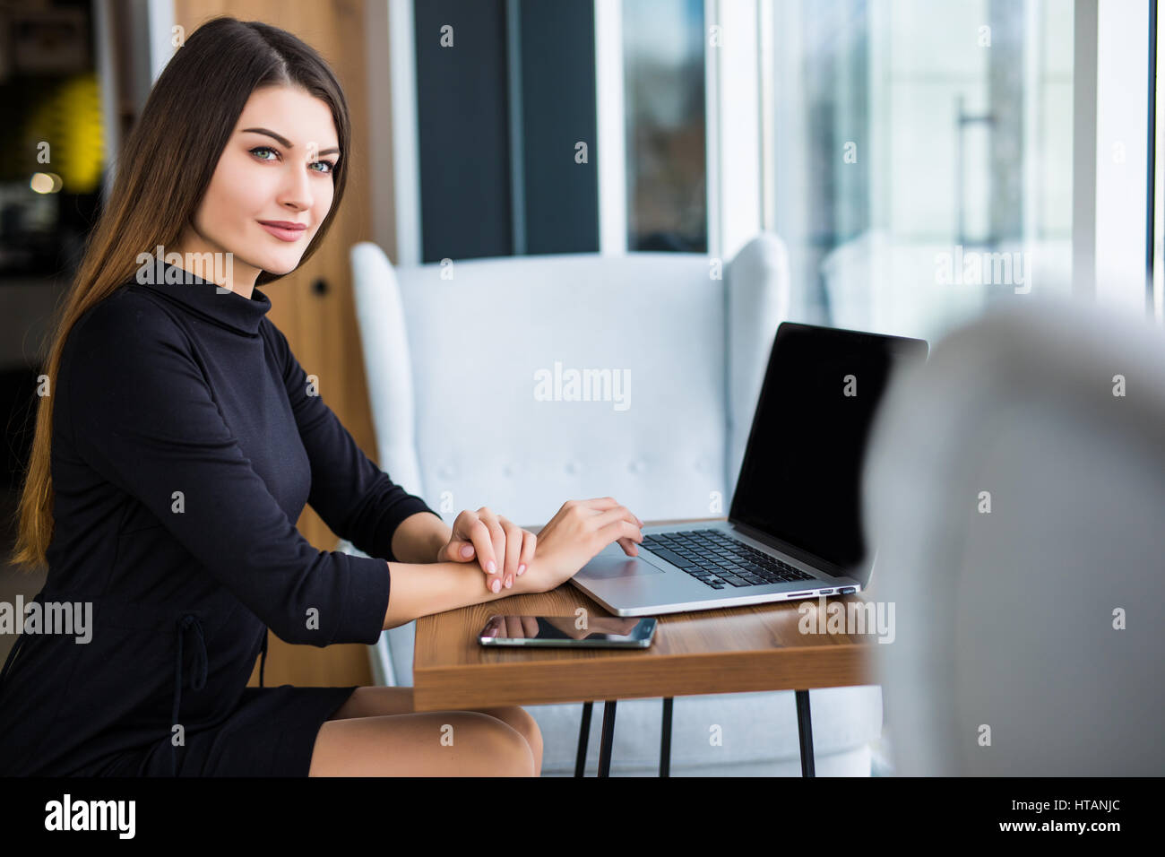 Young beauty businesswoman using laptop in cafe Stock Photo