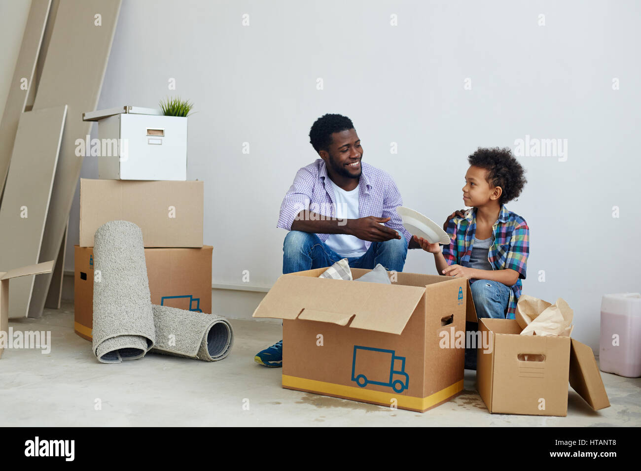 Child unpacking hi-res stock photography and images - Alamy