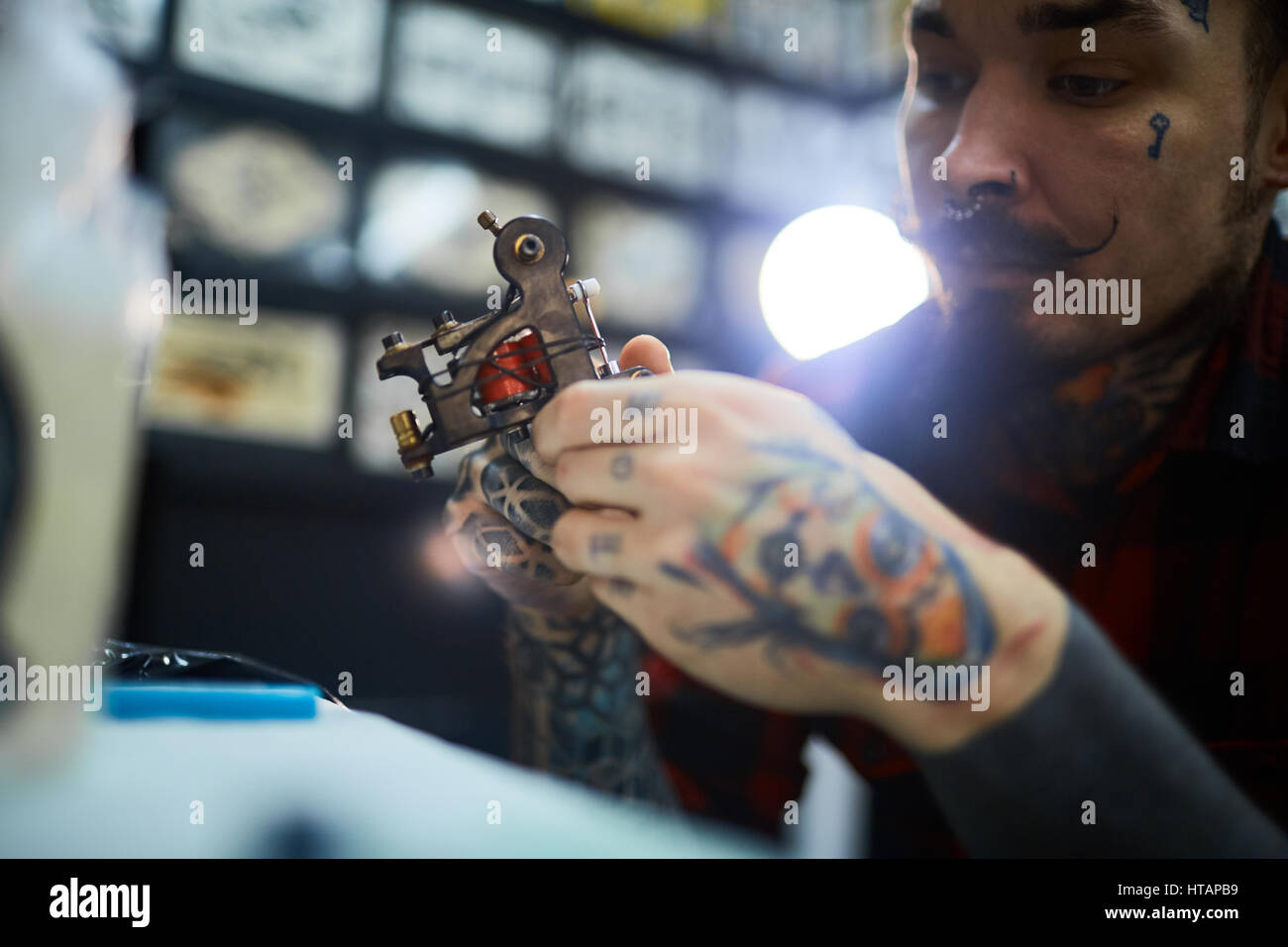 Hand with tattoo gun hi-res stock photography and images - Alamy