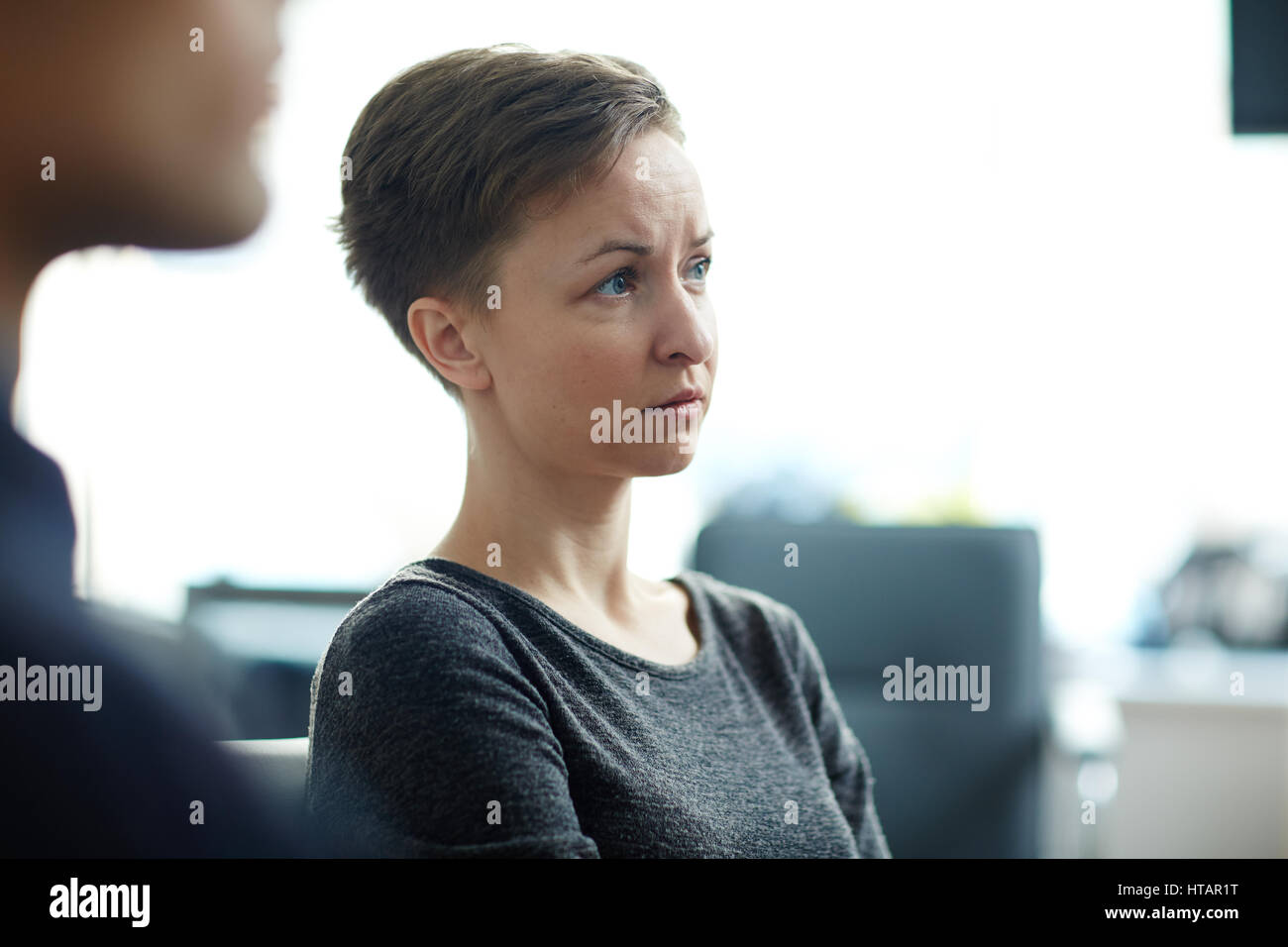 Side View Portrait Of Young Pale Woman With Short Haircut