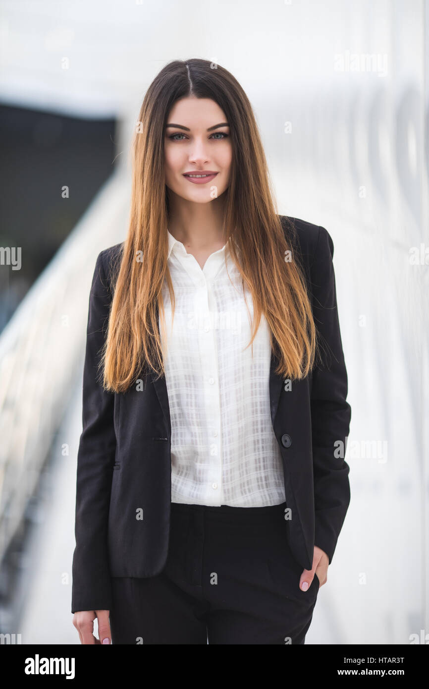 Portrait of a young business woman in office Stock Photo - Alamy