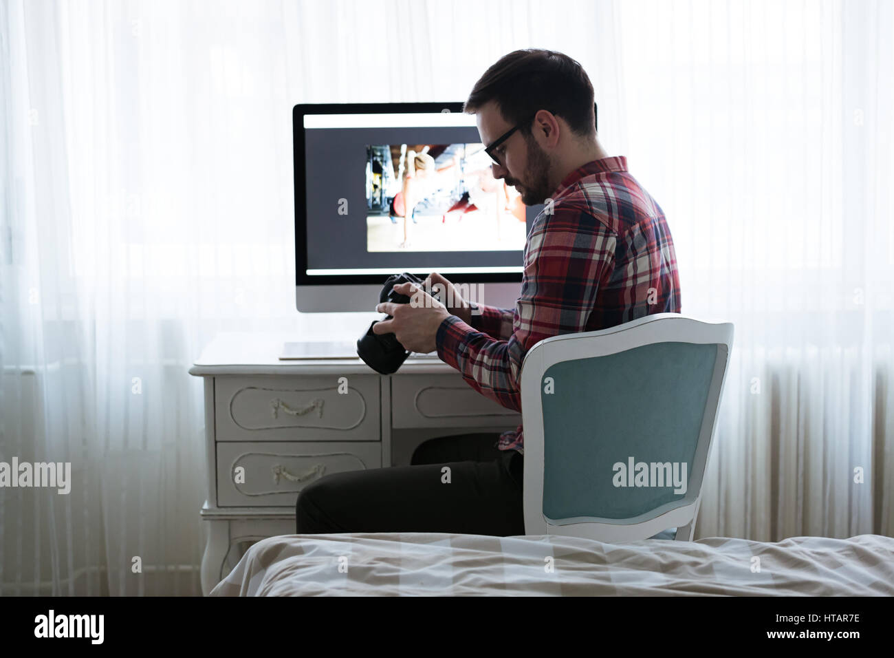Photographer retoucher working on photos and editing on desktop Stock ...