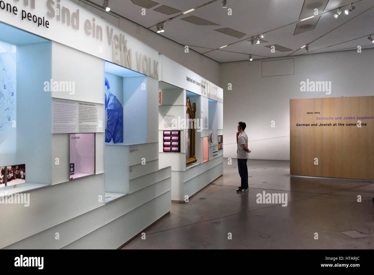 Berlin. Germany. Visitor looking at exhibits at the Jewish Museum. Jüdisches Museum. Stock Photo