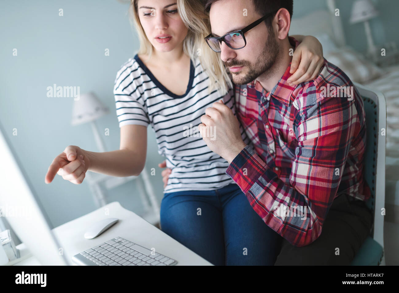 Couple in love working from home on design project Stock Photo
