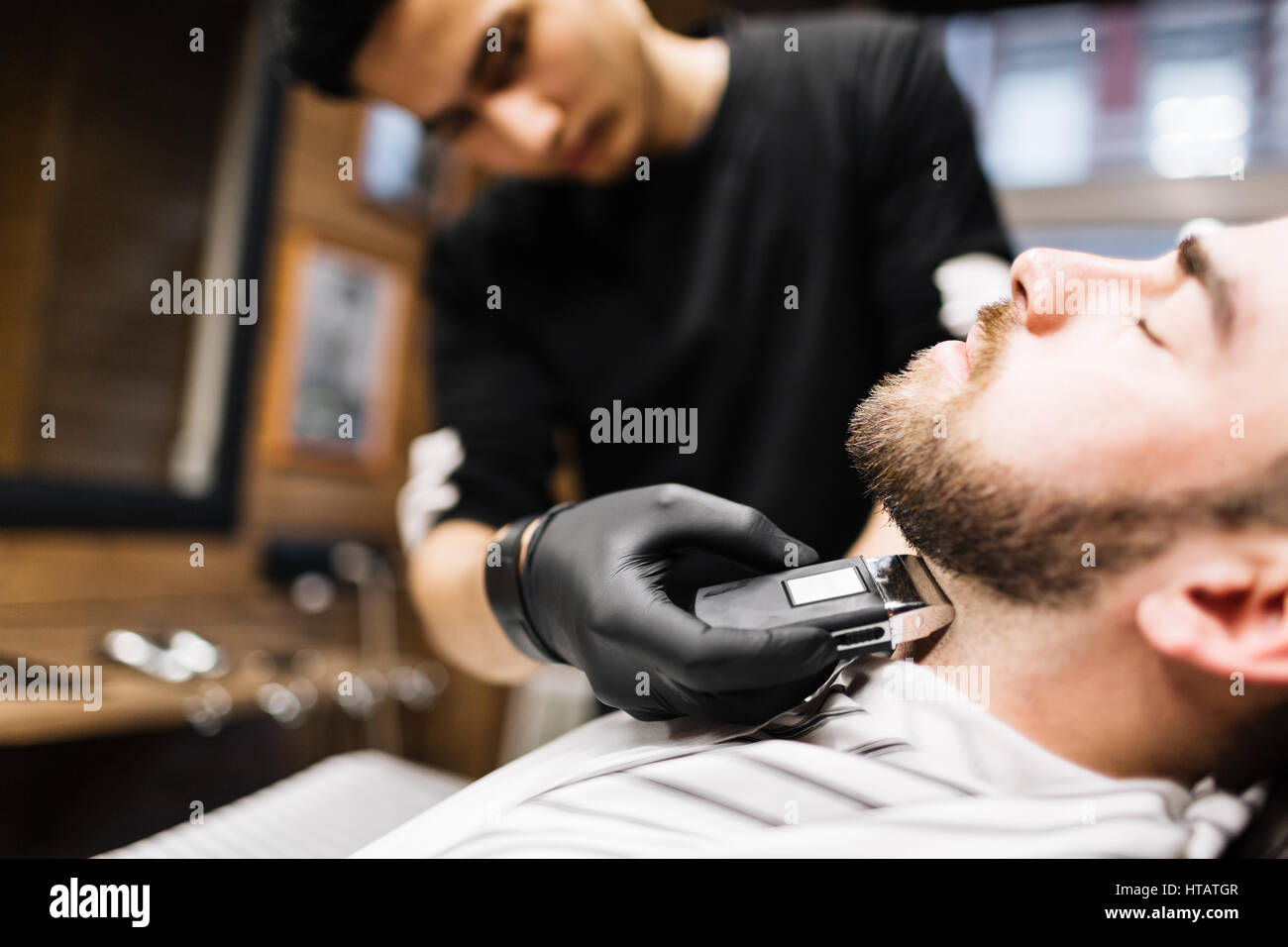Professional barber shaving his client neck Stock Photo Alamy