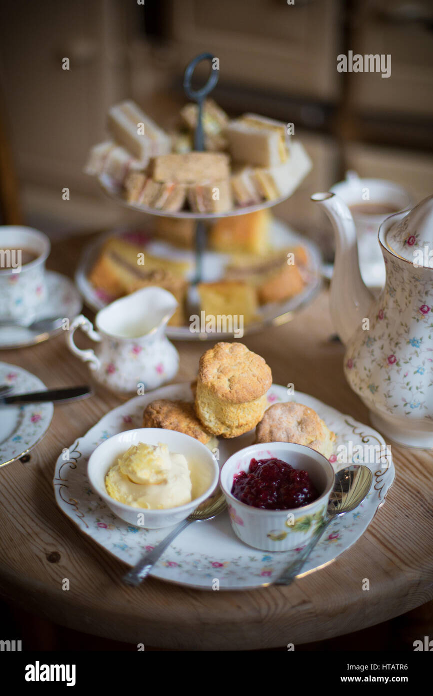 High Tea composed of scones, jam and cream and finger sandwiches and a