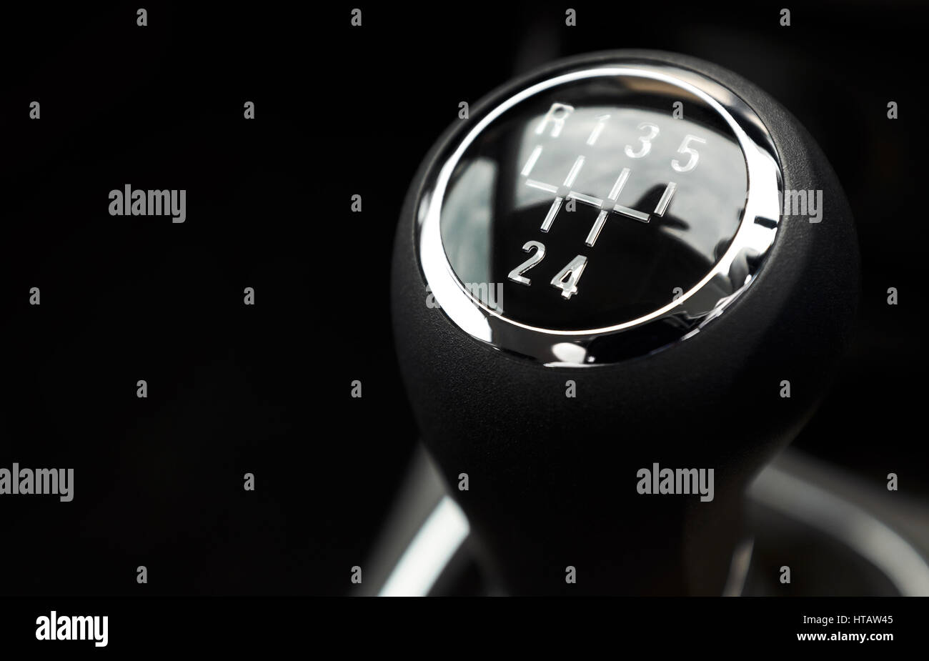 A closeup of a black and silver car gear stick Stock Photo