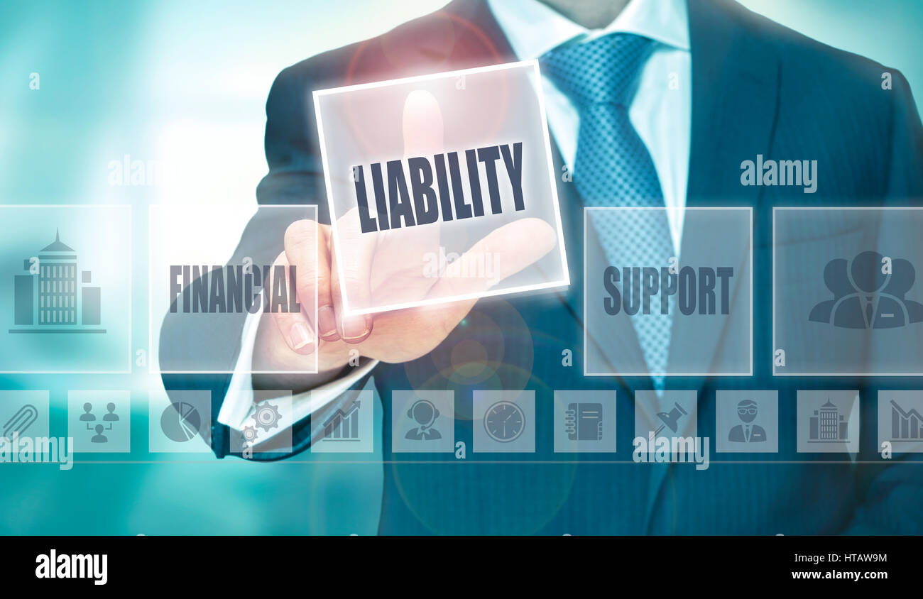 A businessman pressing a Liability button on a transparent screen. Stock Photo
