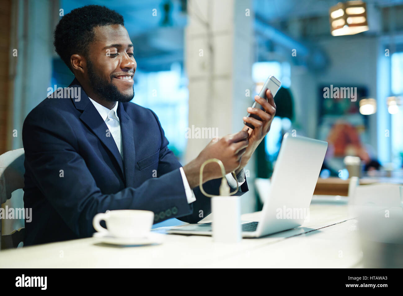 White collar worker plugging adapter into charge port Stock Photo