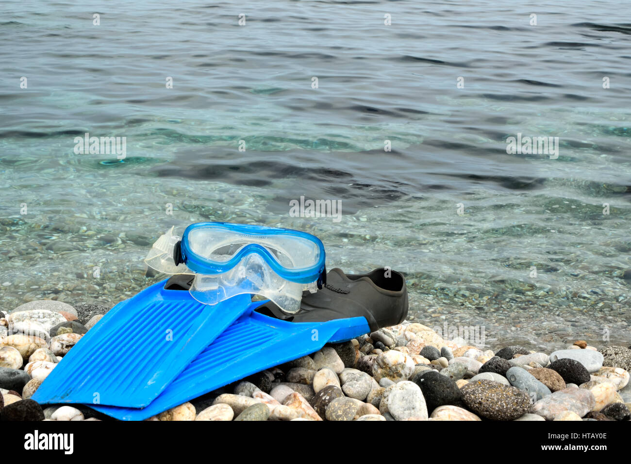 Flippers and snorkel mask on the pebbles beach Stock Photo Alamy