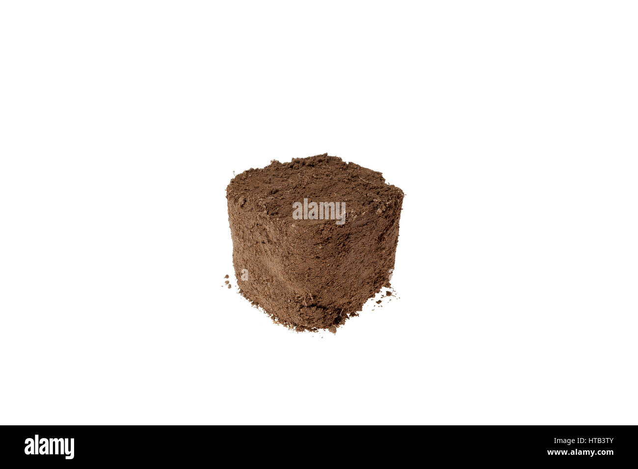 Block of dirt with a white background. Stock Photo