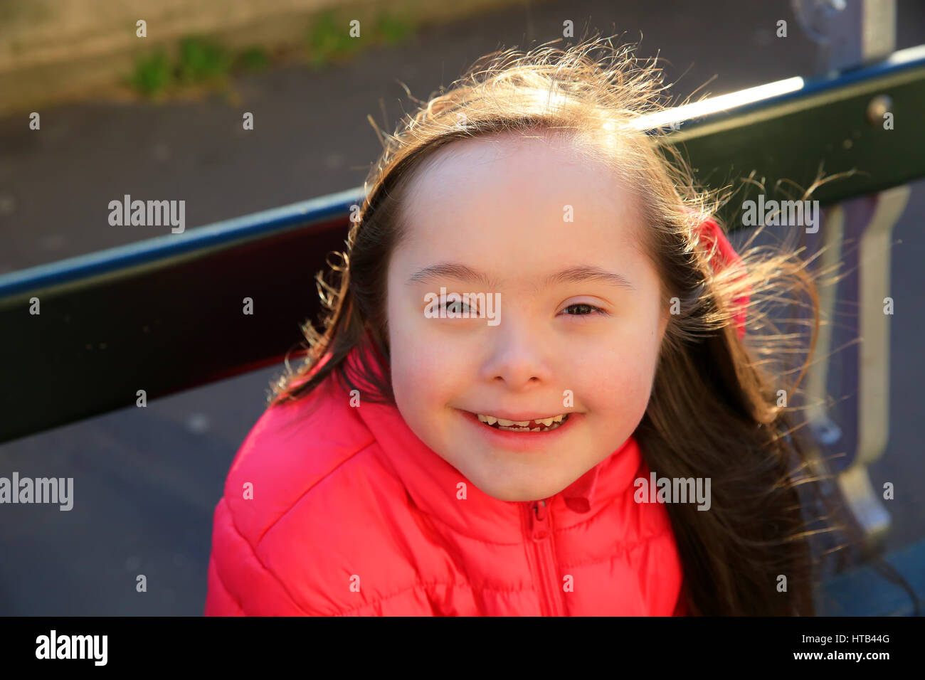 Portrait of little girl smiling outside Stock Photo - Alamy