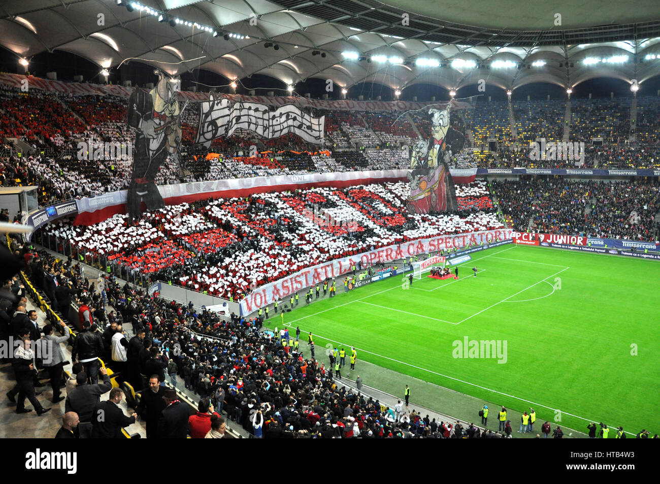 BUCHAREST - APRIL 17: Football supporters of Dinamo Bucharest during a match against Steaua Bucharest, in the National Arena stadium, final score: 1-1 Stock Photo