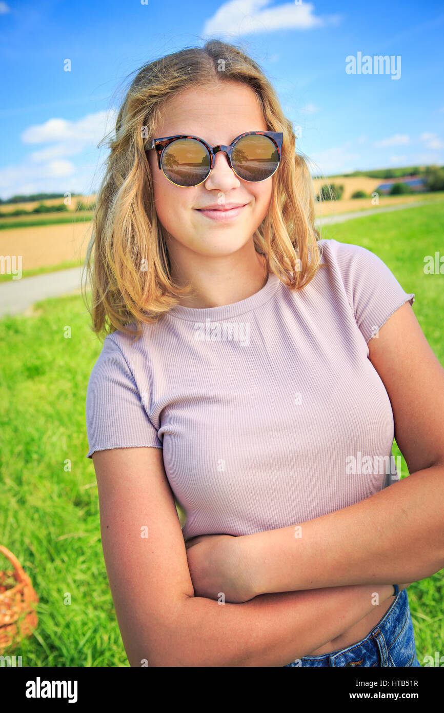 Teenage girl reading rock hi-res stock photography and images - Alamy
