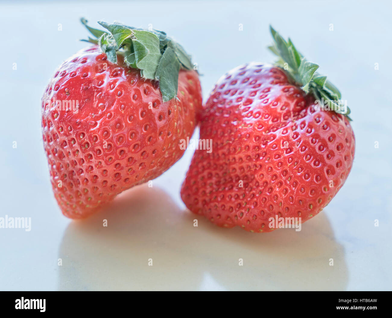 Close up of fresh strawberries on white background Stock Photo - Alamy