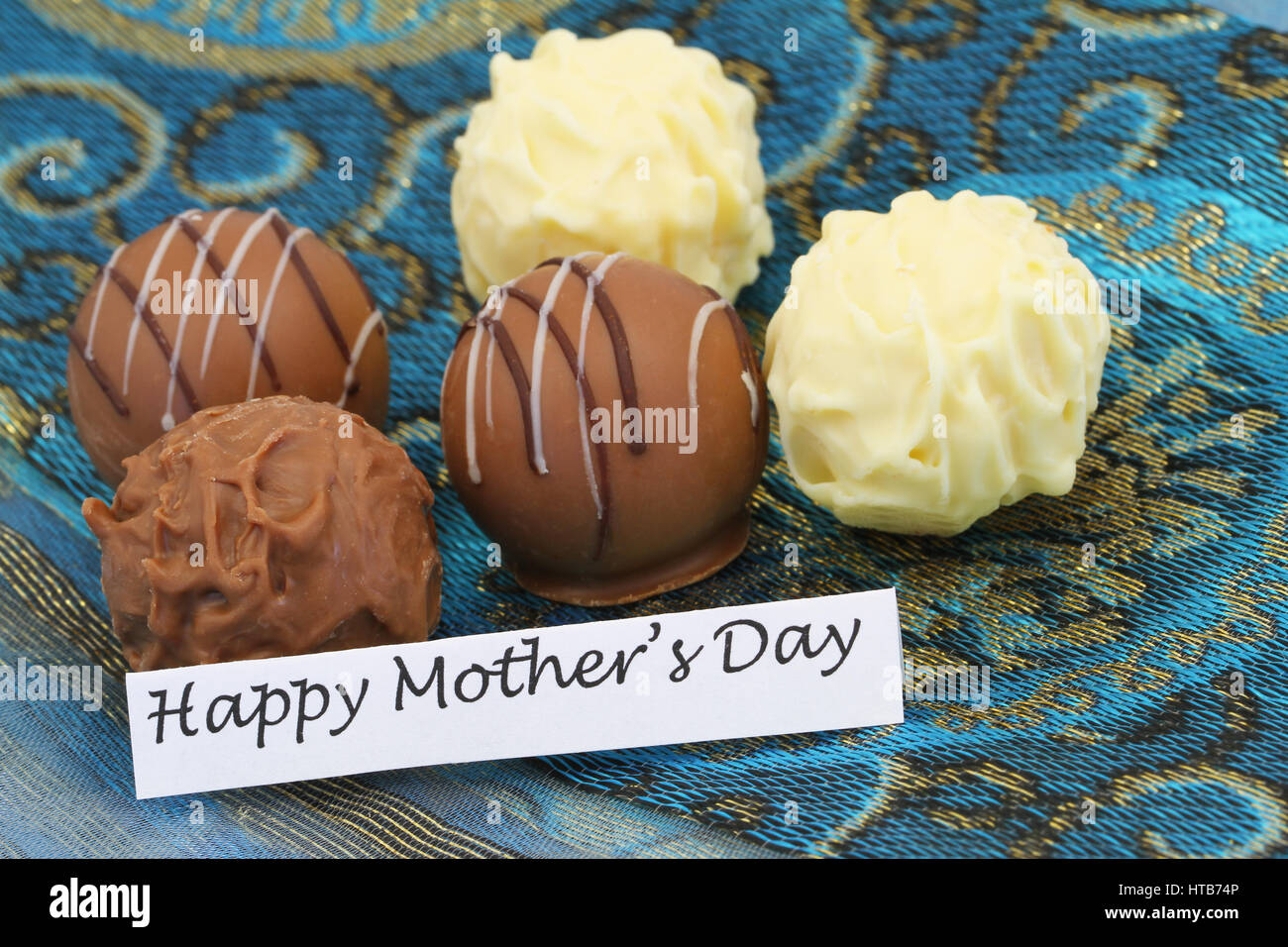 Happy Mother's day card with milk, dark and white truffles Stock Photo