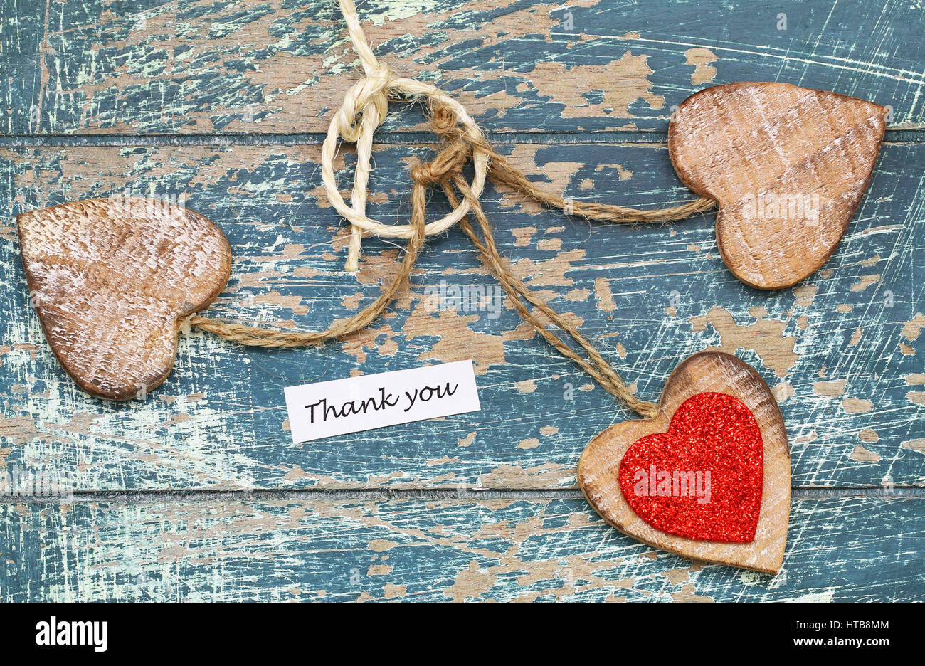 Thank you card with three wooden hearts on rustic wooden surface Stock ...
