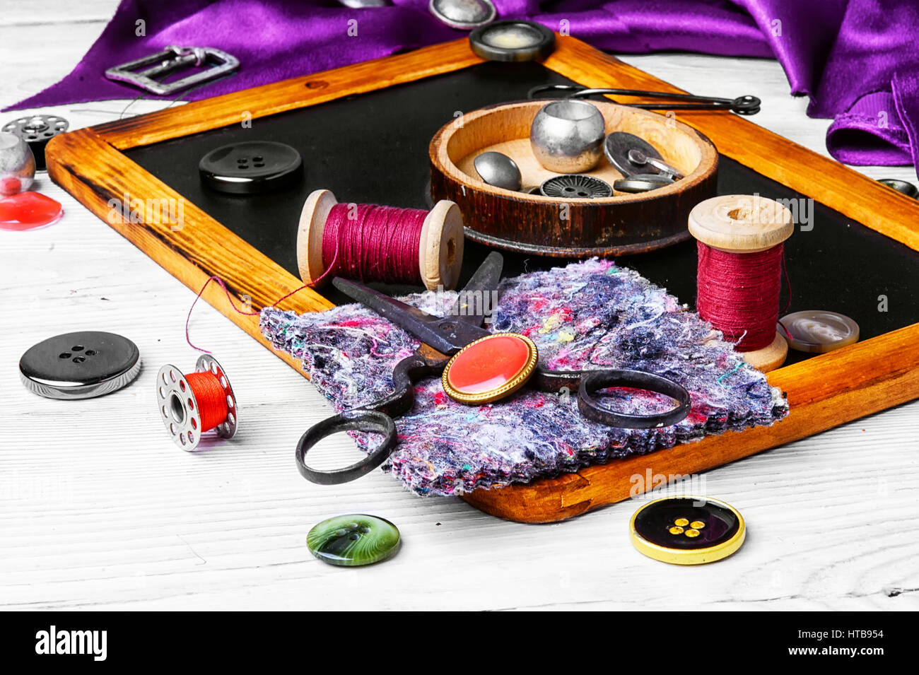 buttons and thread on the chalk board for drawing Stock Photo - Alamy