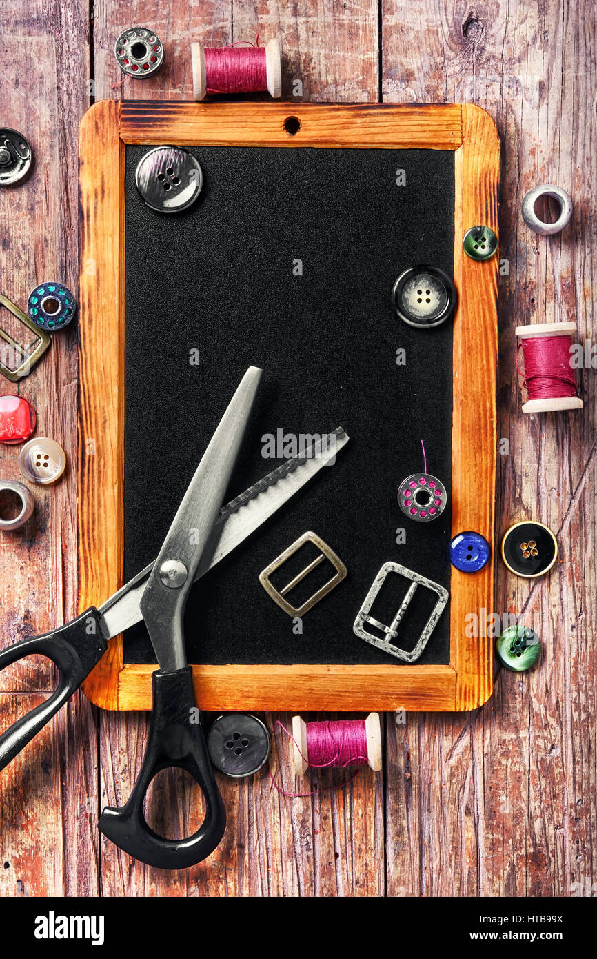 buttons and thread on the chalk board for drawing Stock Photo - Alamy