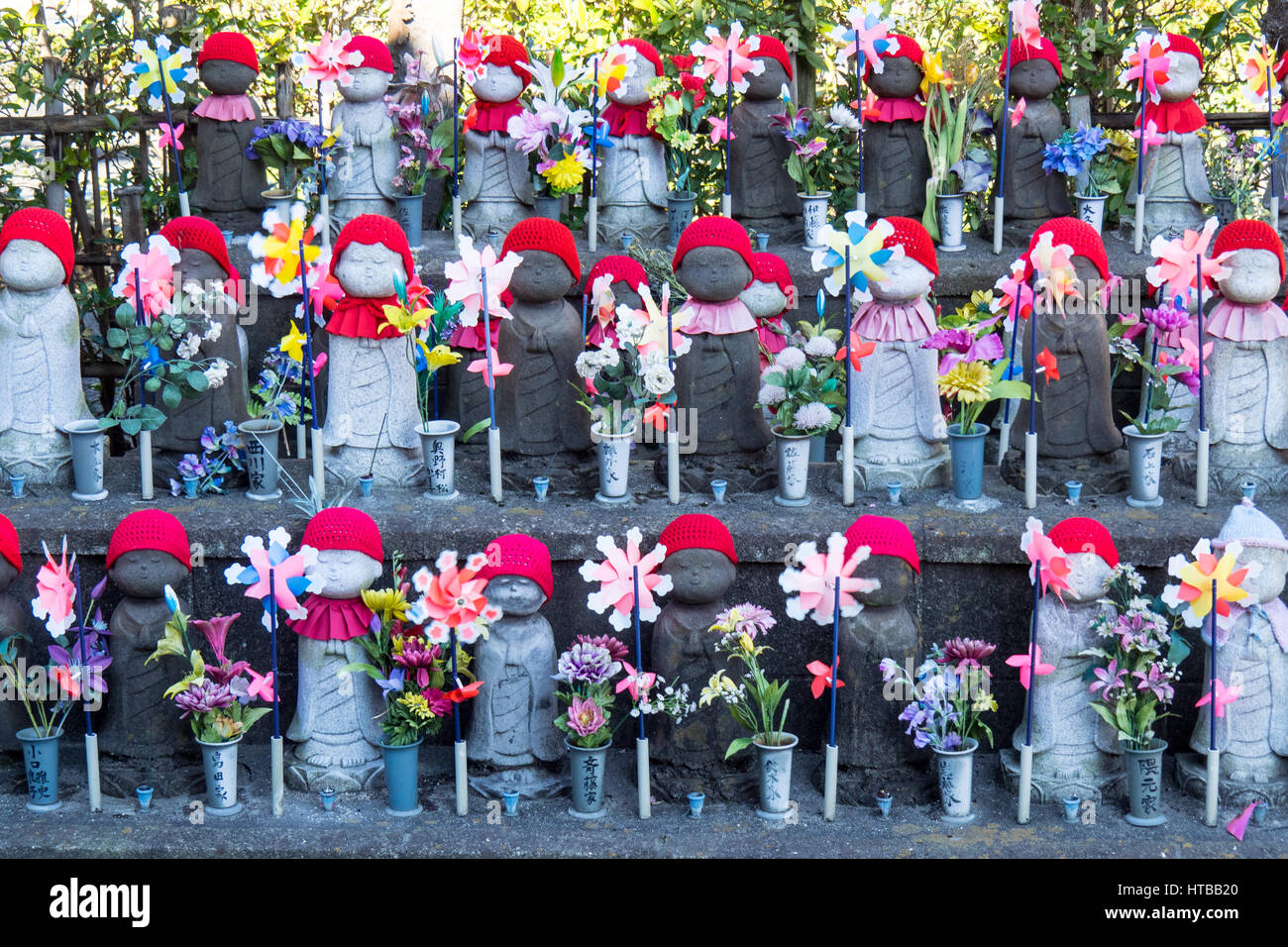 Unborn Children Garden, rows of stone Jizō statues of children representing unborn children in the cemetery at Zōjō-ji temple, Tokyo. Stock Photo