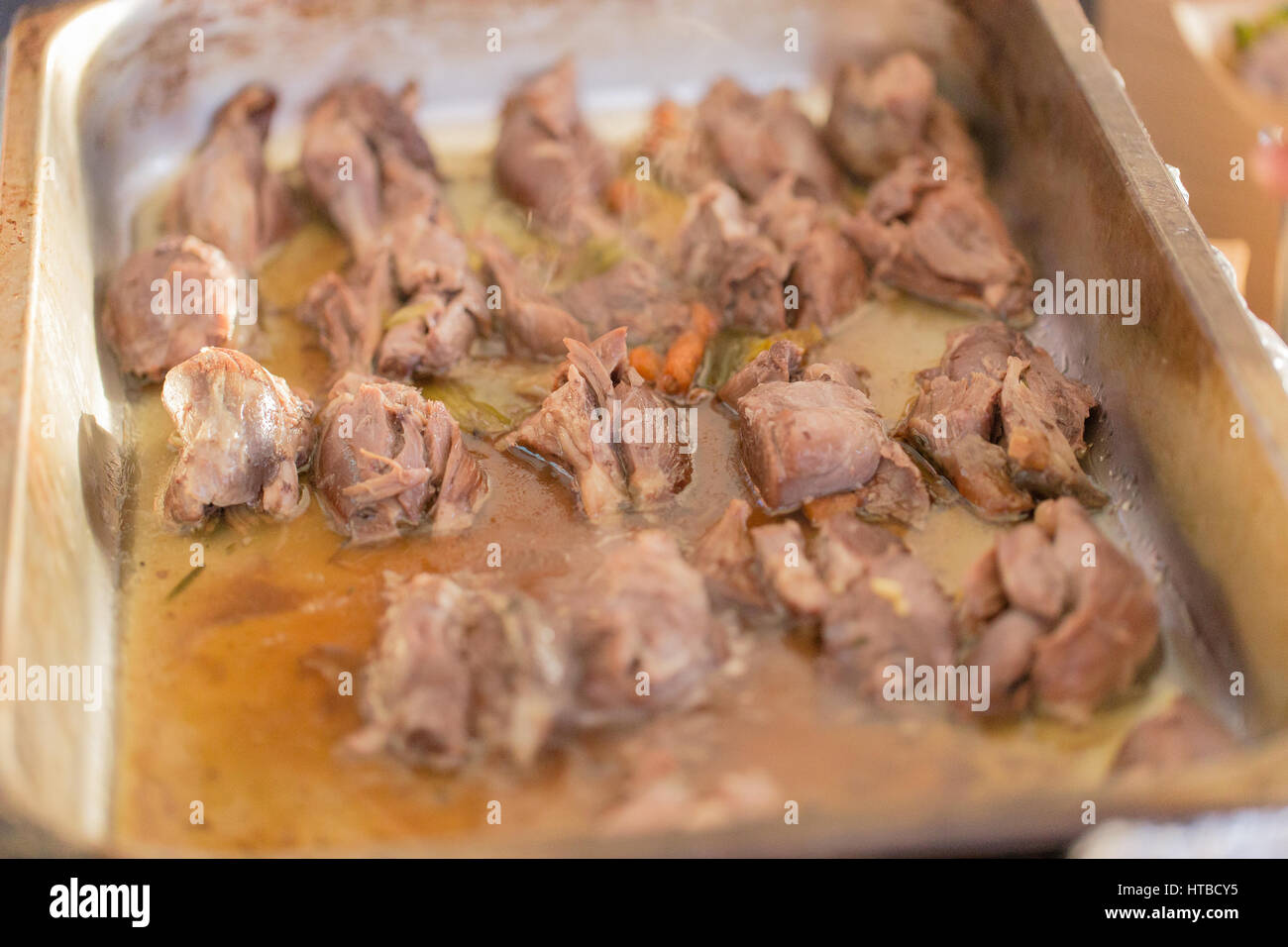 meat soaking in juice cooking Stock Photo Alamy