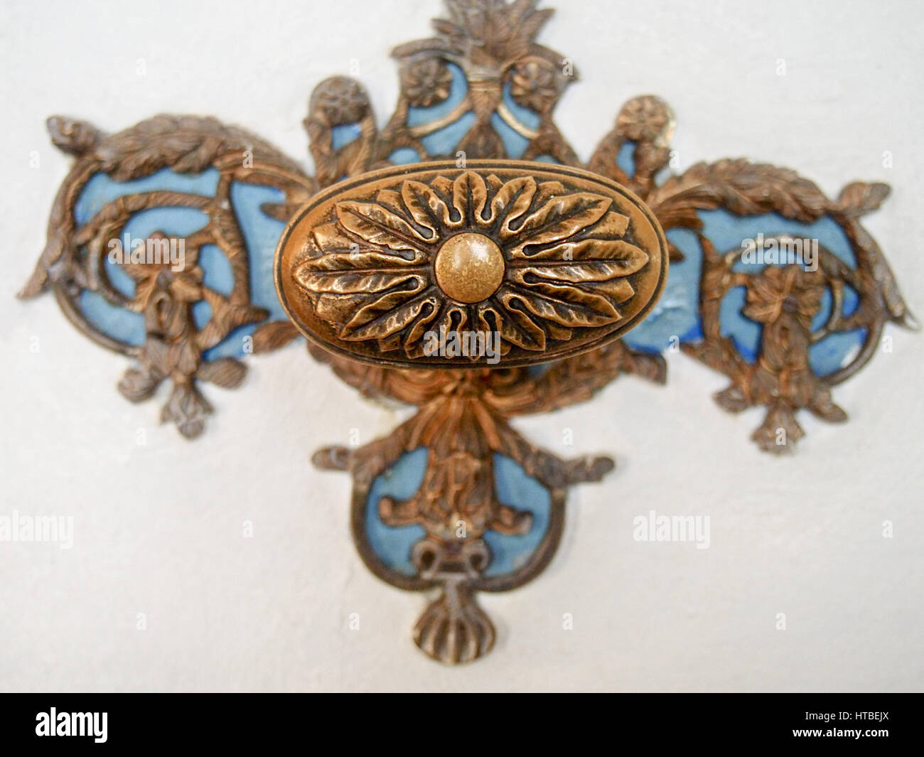 Detail of a decorative doorknob with blue and copper color. Stock Photo