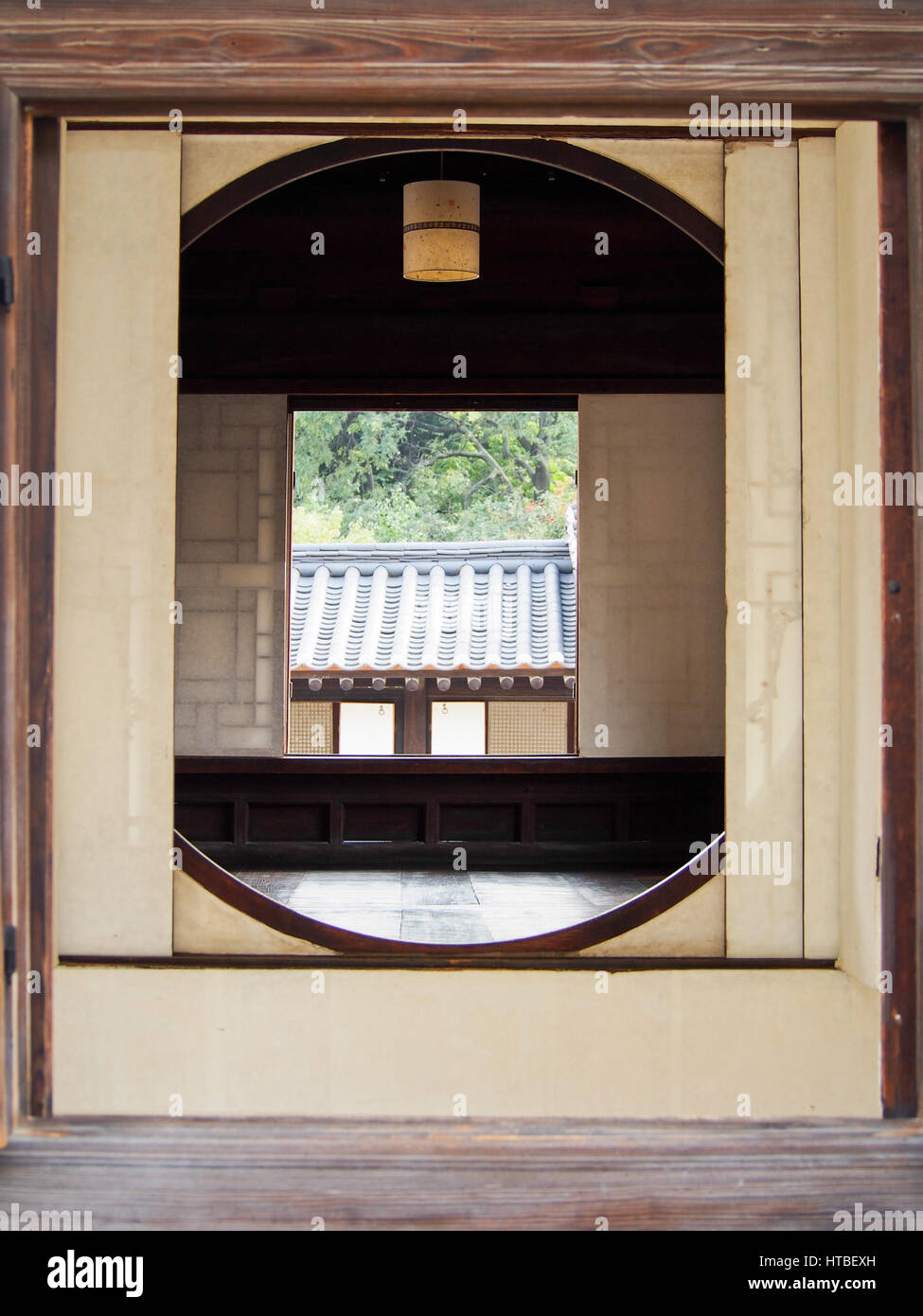 A traditional round window at a palace in Seoul, South Korea. Stock Photo