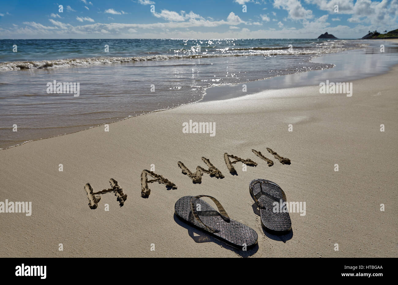 Hawaii Beach Sand and Slippers Stock Photo
