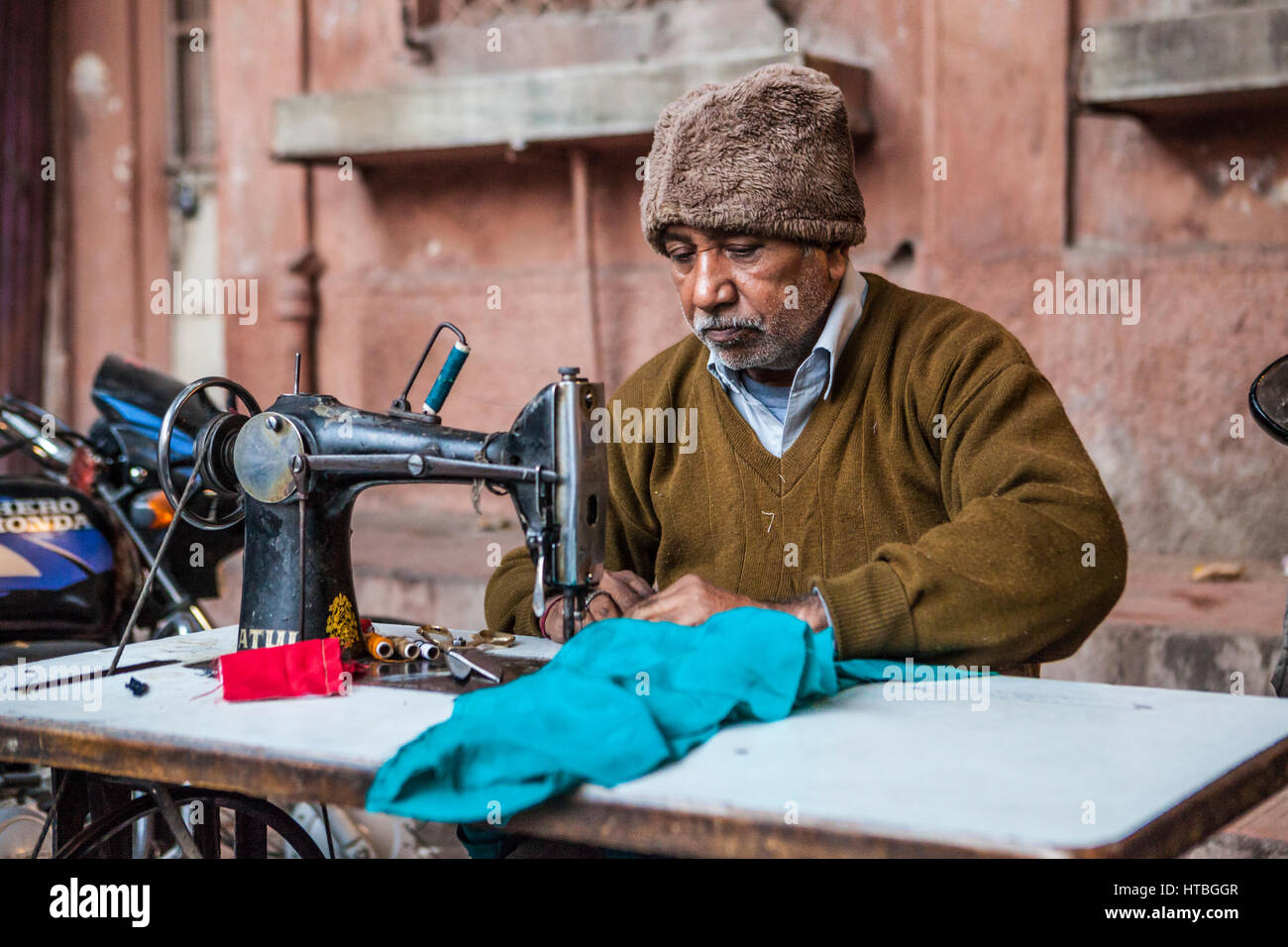 A man working at a sewing machine in Sadar Market in Jodhpur Stock