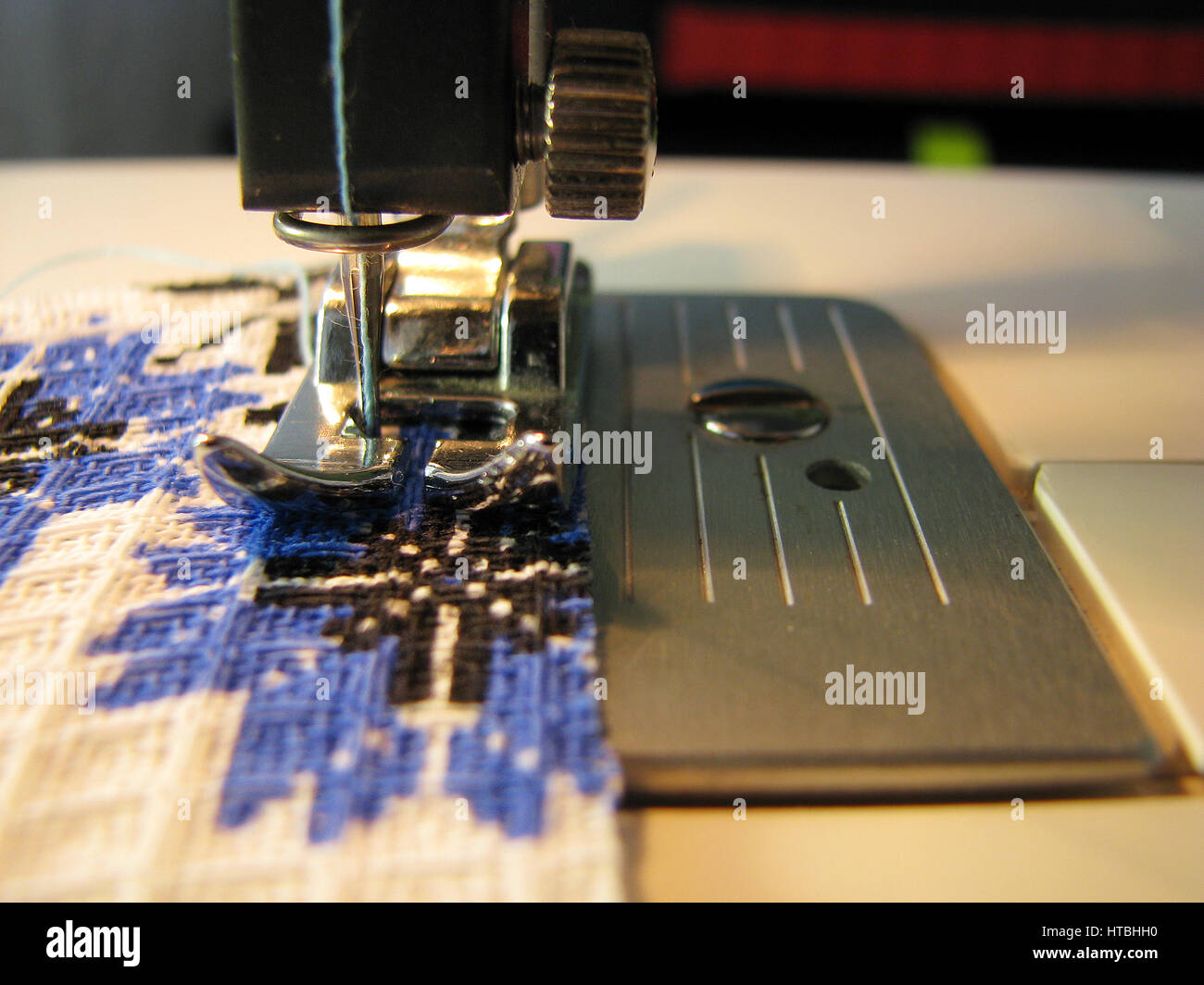 Manual sewing on the machine. Clothing repair Stock Photo Alamy