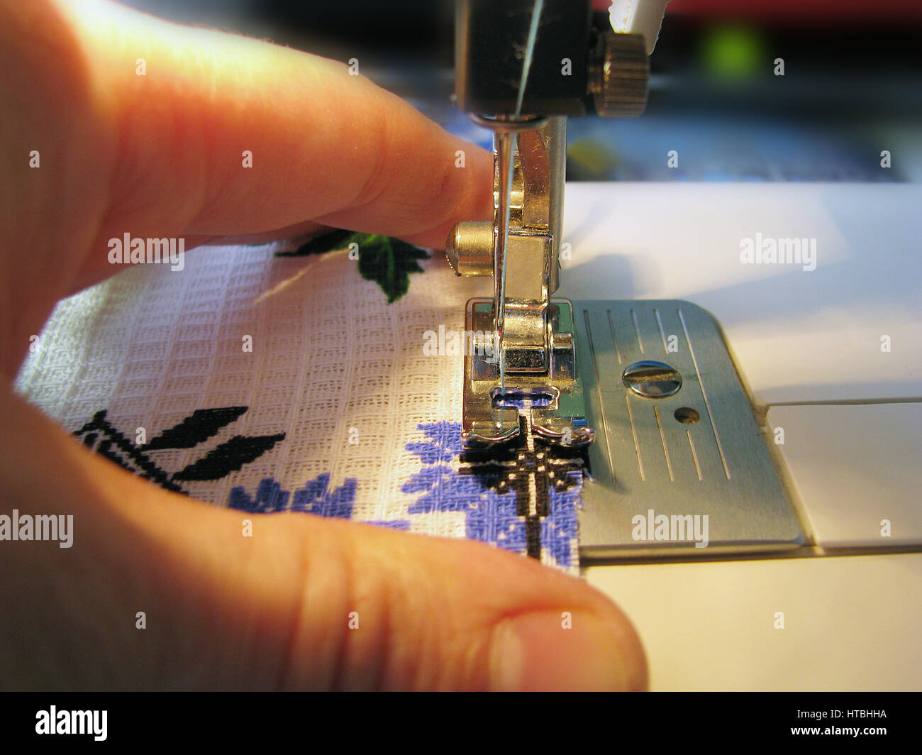 Manual sewing on the machine. Clothing repair Stock Photo Alamy