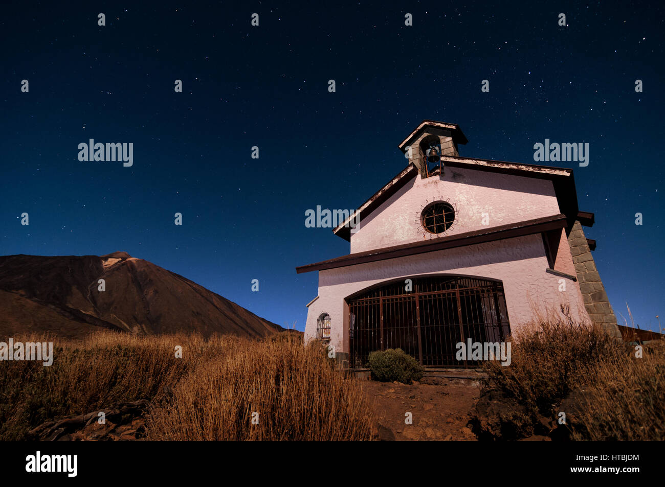 Hermitage Ermita de las Nieves church chapel with Mount Teide and stars in the background at night, Tenerife, Canary Islands Stock Photo