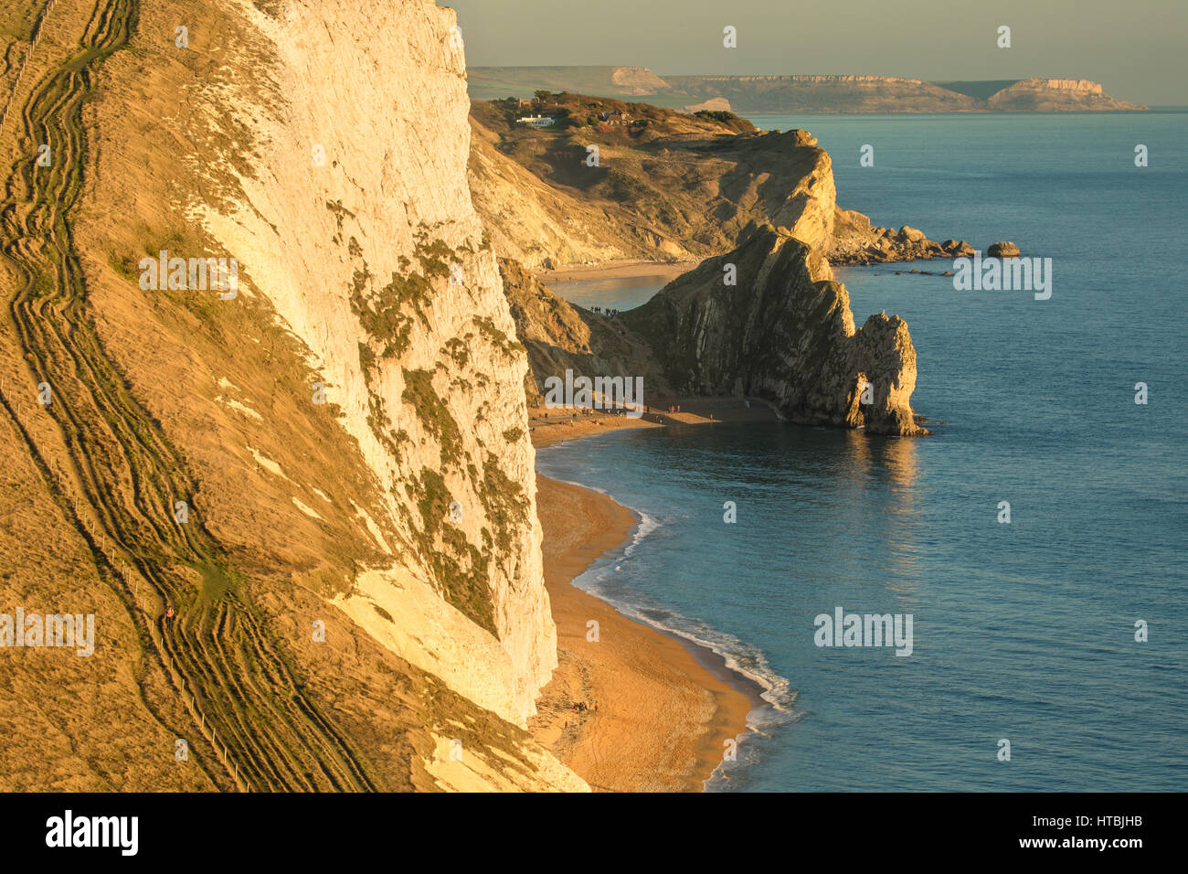 Durdle Door and St Oswald's Bay from Bat's Head at dusk, Purbeck, Jurassic Coast, Dorset, England, UK Stock Photo