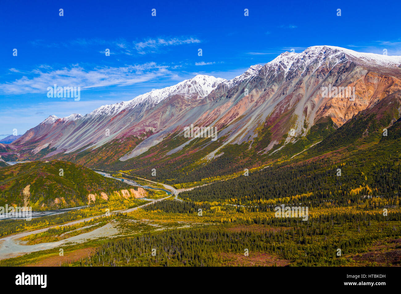 Rainbow Ridge towers over the Richardson Highway in autumn; Alaska