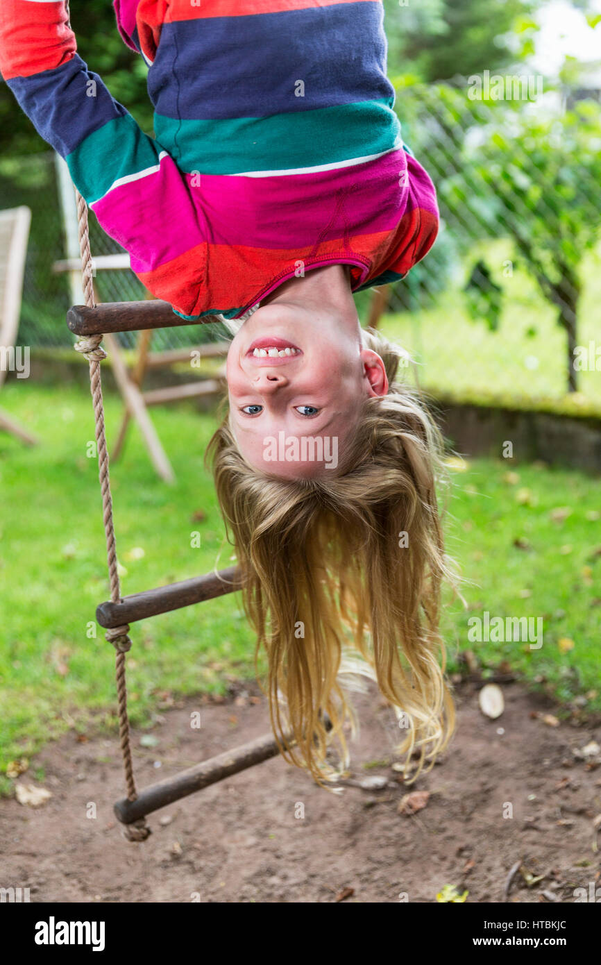 Girl hanging upside down from hi-res stock photography and images - Alamy