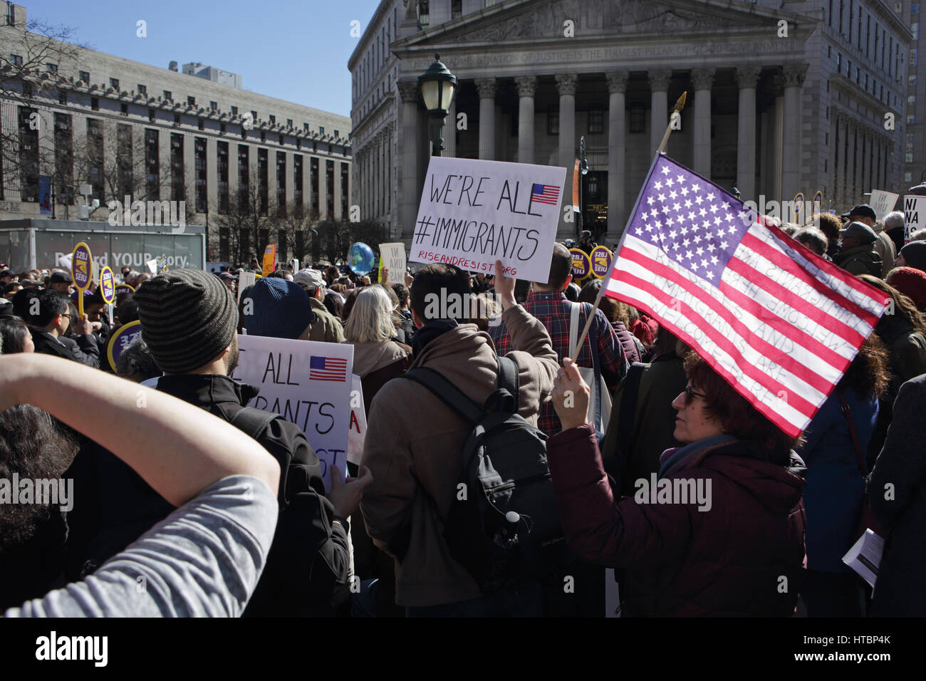 New York, NY, USA - March 9, 2017: A group of about 100 people rally in Foley Square, outside a courthouse in Manhattan, to protest Trump travel ban Stock Photo
