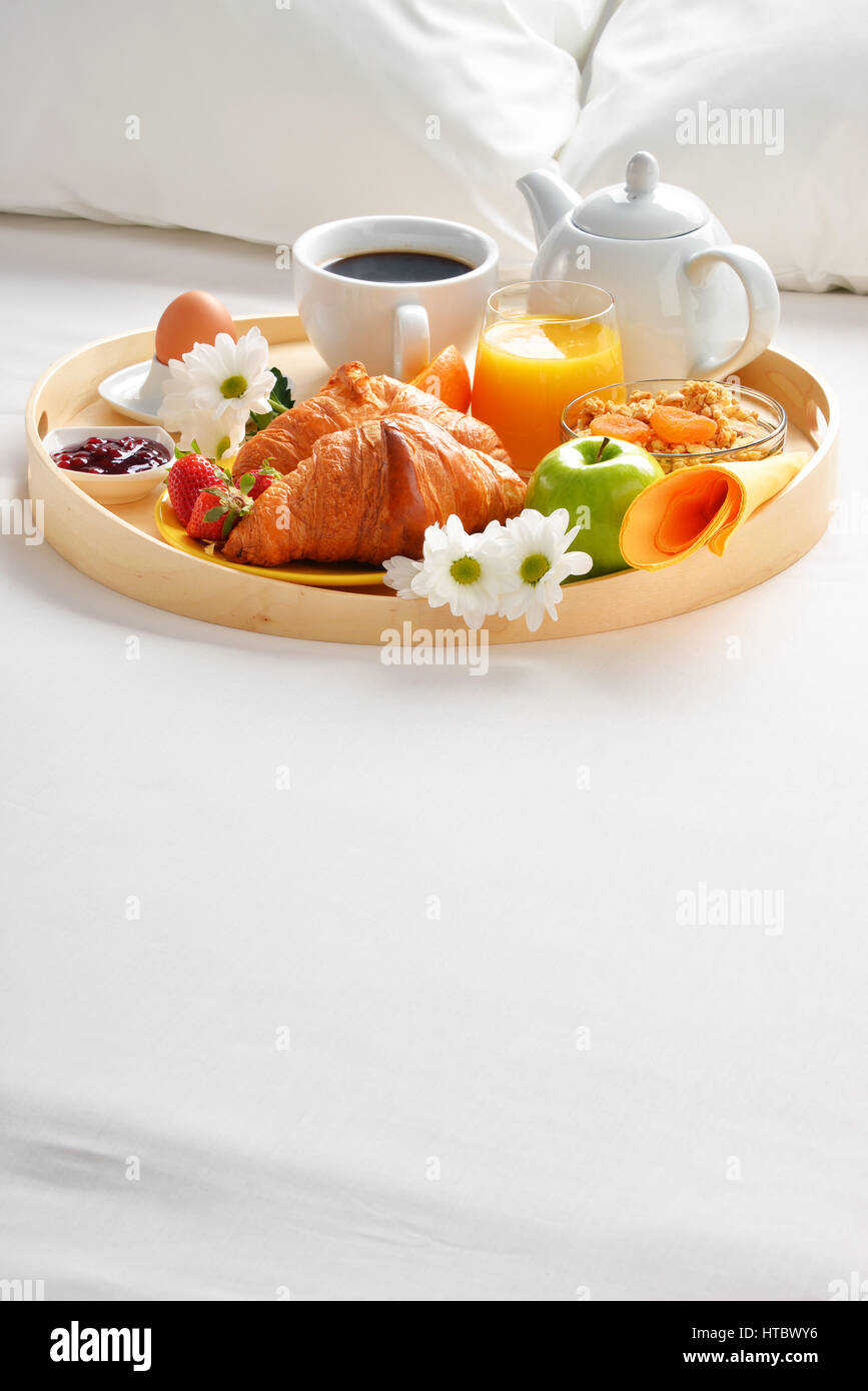 Breakfast tray in bed in hotel room Stock Photo - Alamy