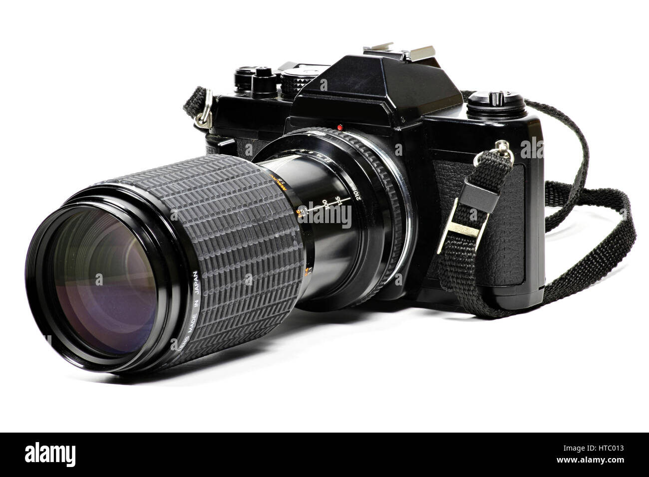 analogue single-lens reflex camera with telephoto lens isolated on white background Stock Photo