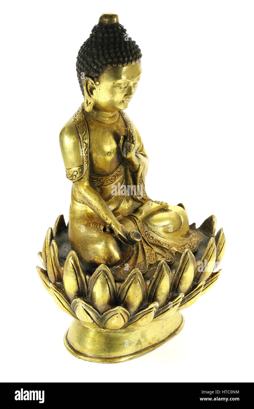antique brass Buddha in meditation on lotus flower isolated on white background Stock Photo