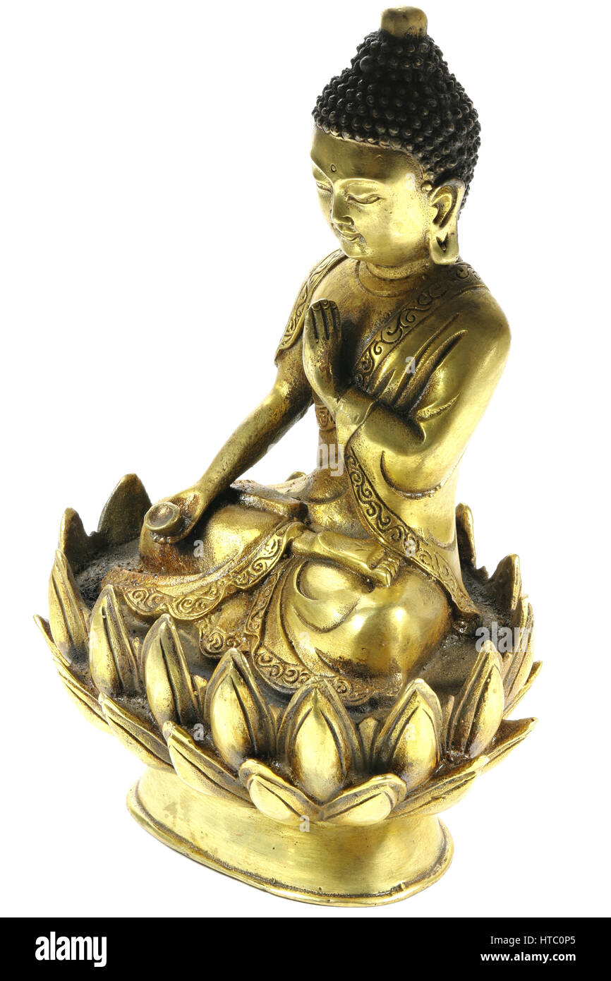 antique brass Buddha in meditation on lotus flower isolated on white background Stock Photo