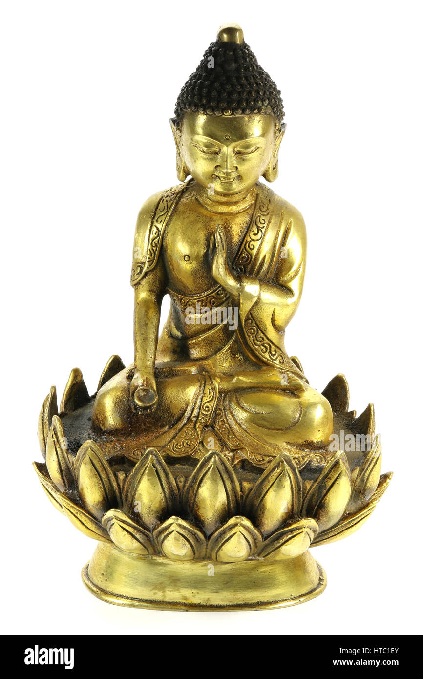 antique brass Buddha in meditation on lotus flower isolated on white background Stock Photo