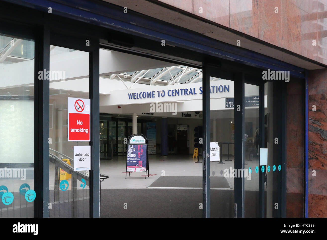 Automatic doors into The Central Railway Station in Belfast, Northern Ireland, part of the Northern Ireland Railway network. Stock Photo