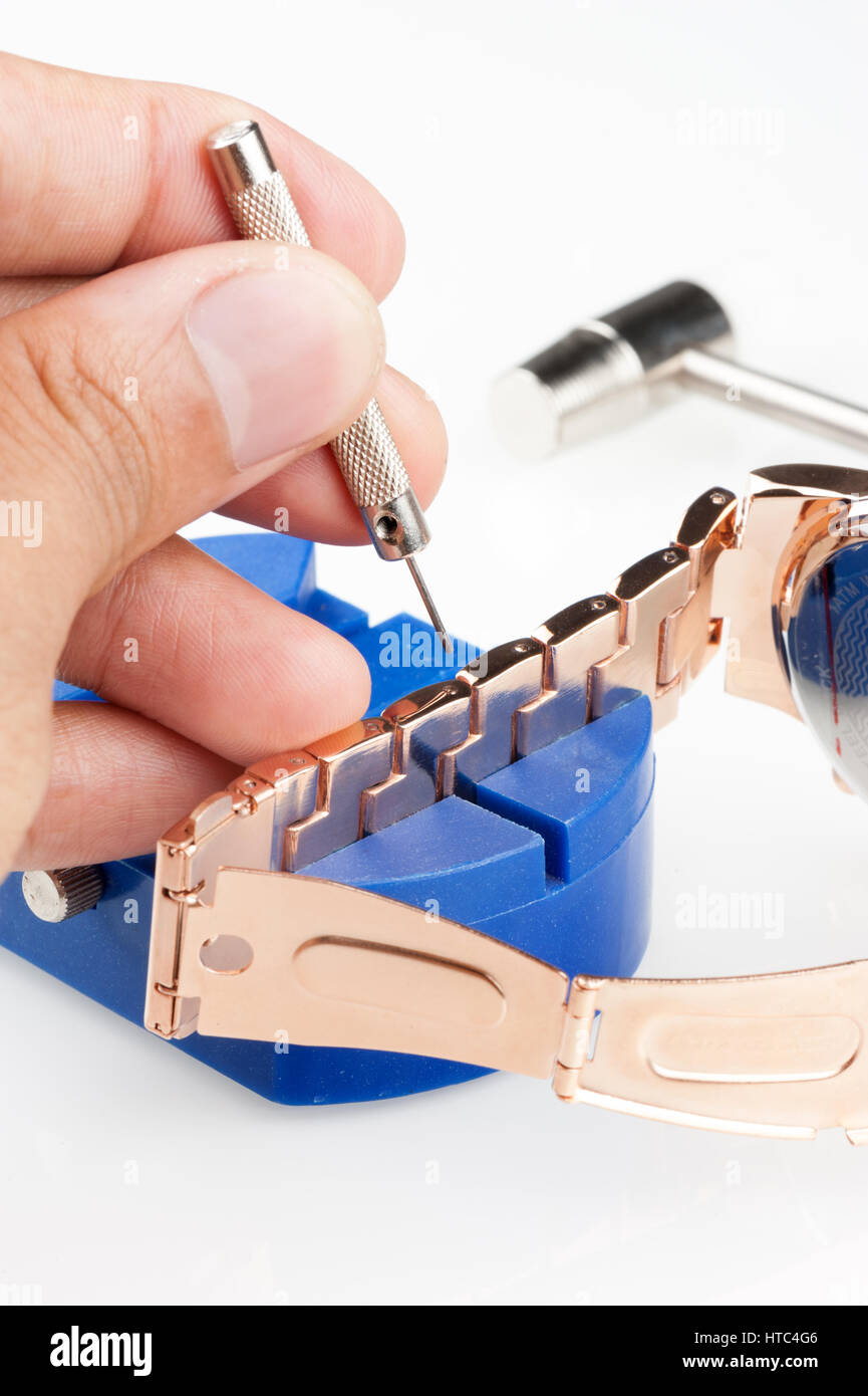 adjusting the watch bracelet with pin punch, tool for watch Stock Photo