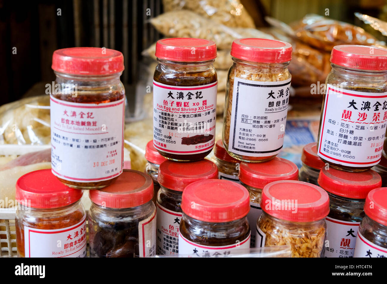 Jars of salted minced fish and fish egg and shrimp XO sauce, two traditional products from Tai O, a fishing village on Lantau Island, Hong Kong, China Stock Photo