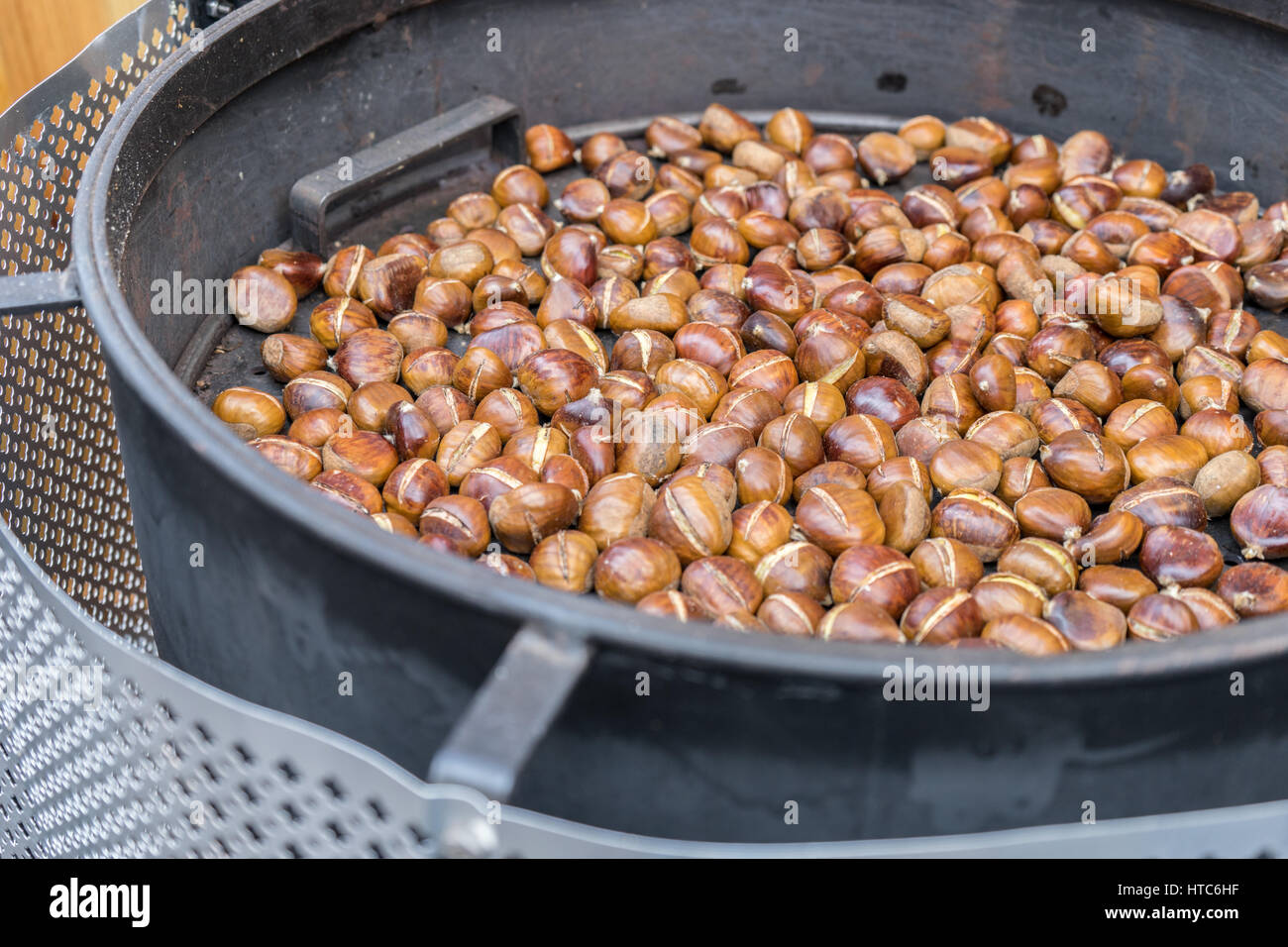 Chestnuts are roasted in a pan Stock Photo