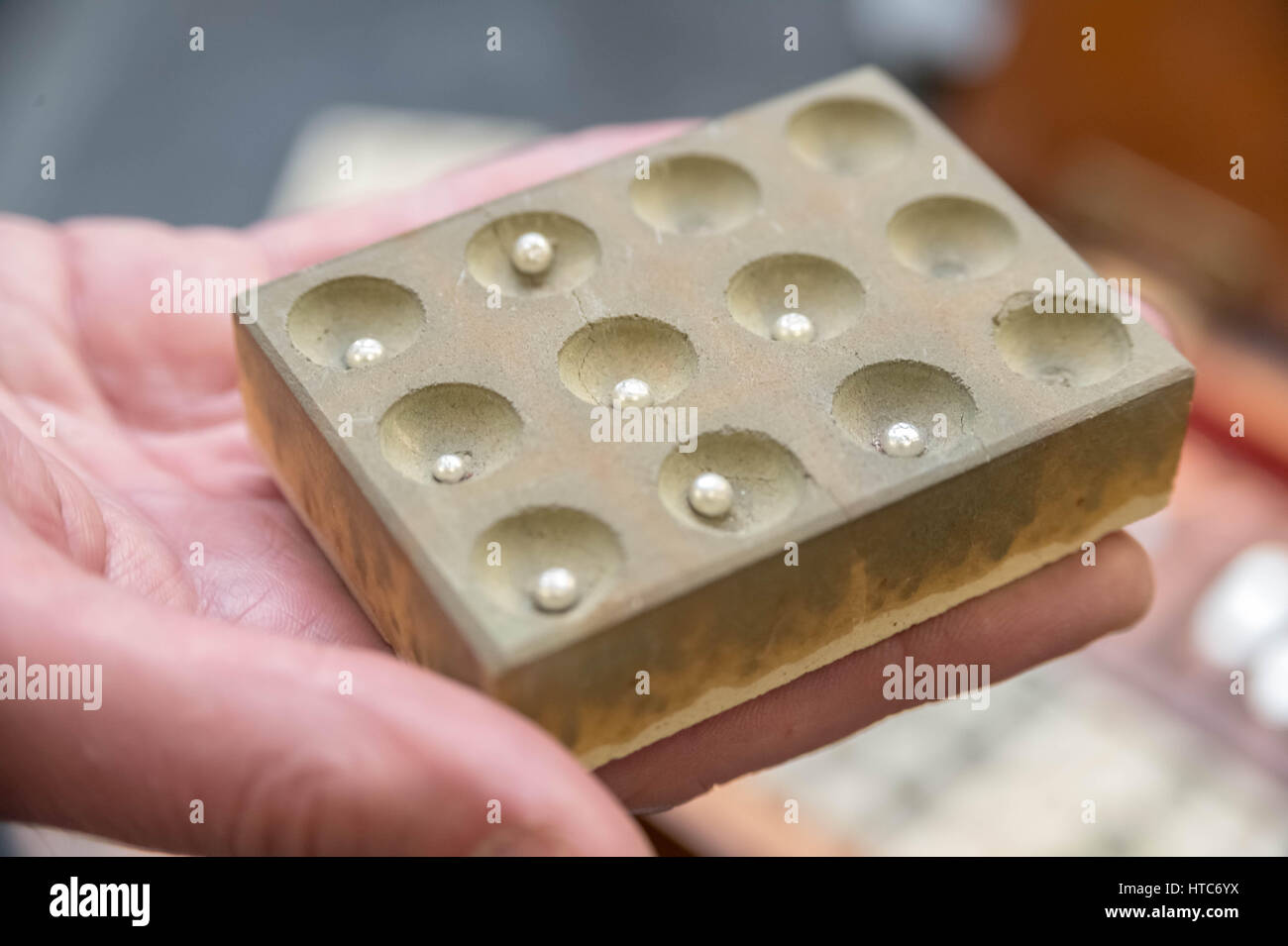 Metallurgical assaying. Precious metal purity tests at The Assay Office in London, UK. Stock Photo