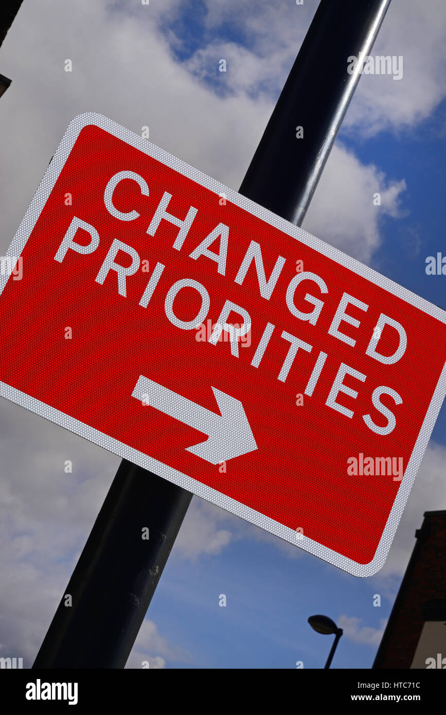 changed priorities road sign united kingdom Stock Photo