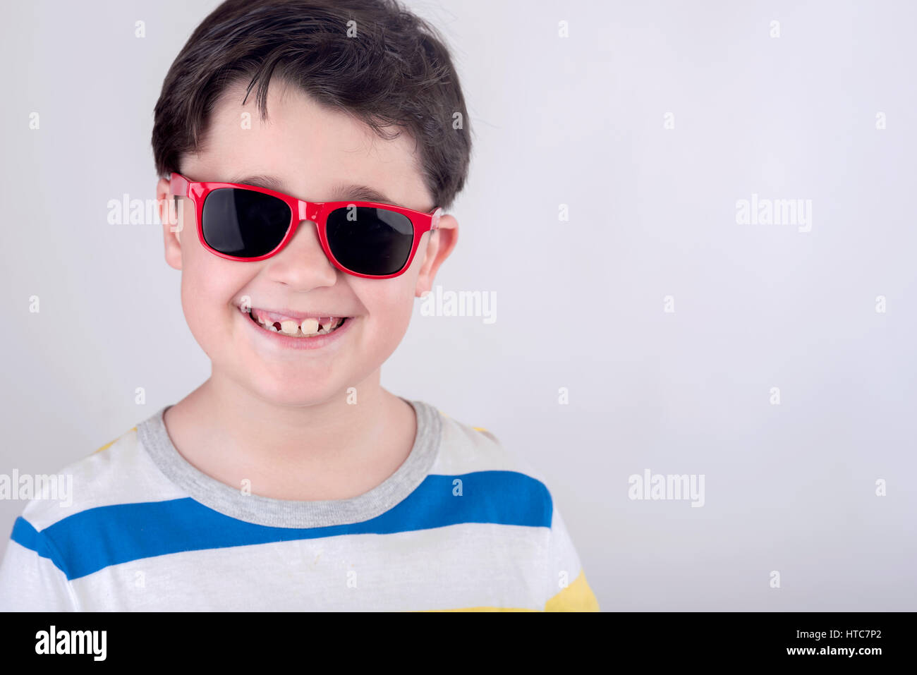 Smiling boy with sunglasses Stock Photo
