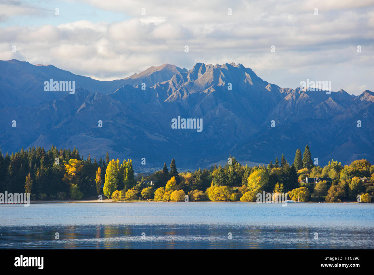 Wanaka, Otago, New Zealand. View across Roys Bay, evening, golden